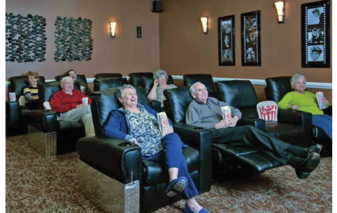 A living room with a large screen TV, a couch, and a chair. AI generated content