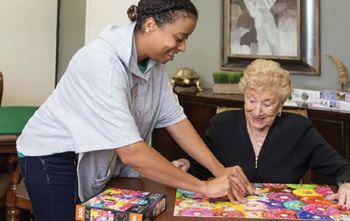 An older woman and a younger woman are playing a game together. AI generated content